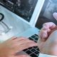 A Person Holding a Laptop computer in a desk for a medical purpose.