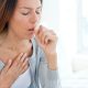 A Woman get Coughed In A White Background.