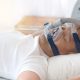 A man wearing Cpap mask for sleeping without snoring.