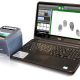 A Fingerprint Scanner & Laptop Showing Fingerprint Samples.